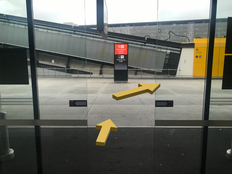 Four interior photos of an outdated Brisbane car hire branch. Images are divided into four squares by a yellow outline.